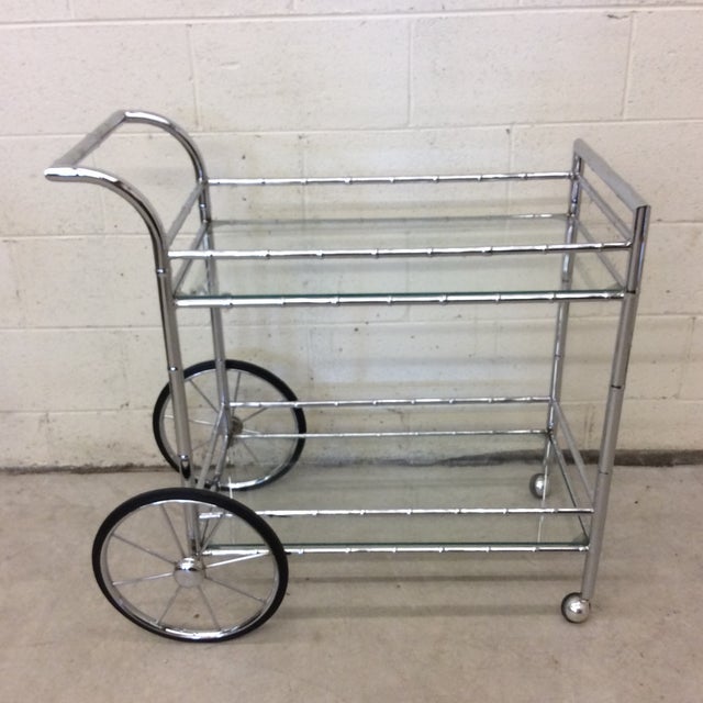 Beautiful chrome Chinoiserie faux bamboo bar cart with large front spoke wheels and casters. I have seen these labeled...