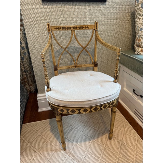 Striking neoclassical–style accent chair featuring an intricately painted wood frame with elegant hand-decorated detailing...