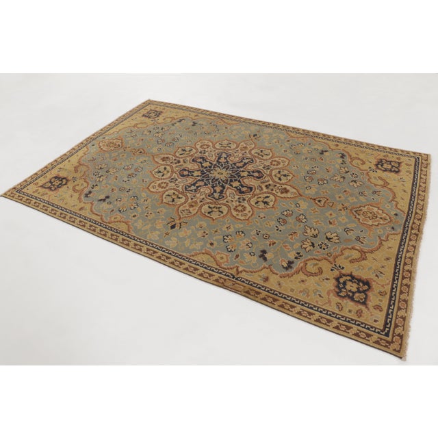 This 6x9 antique English rug is an exclusive piece curated by Rug & Kilim, hand-knotted in wool and believed to originate...