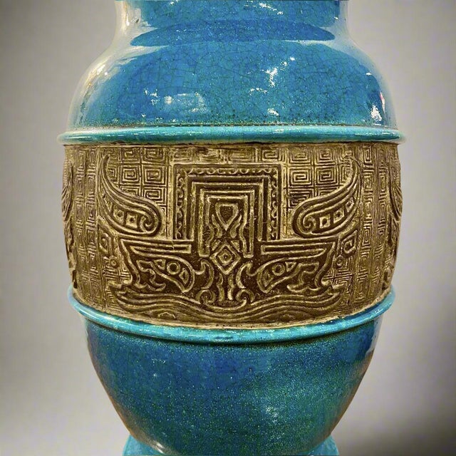 A Mid Century glazed ceramic Italian vase featuring a terrific blue glaze. The vase is girdled with an unglazed band of...
