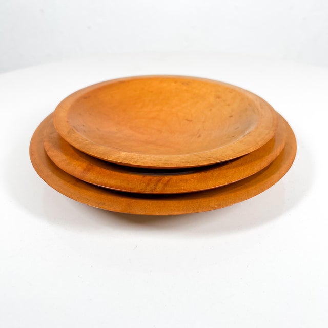 AMBIANIC presents Set of Three Vintage Maple Wood Plates Ghost label remains on the backside for the sticker. USA circa...