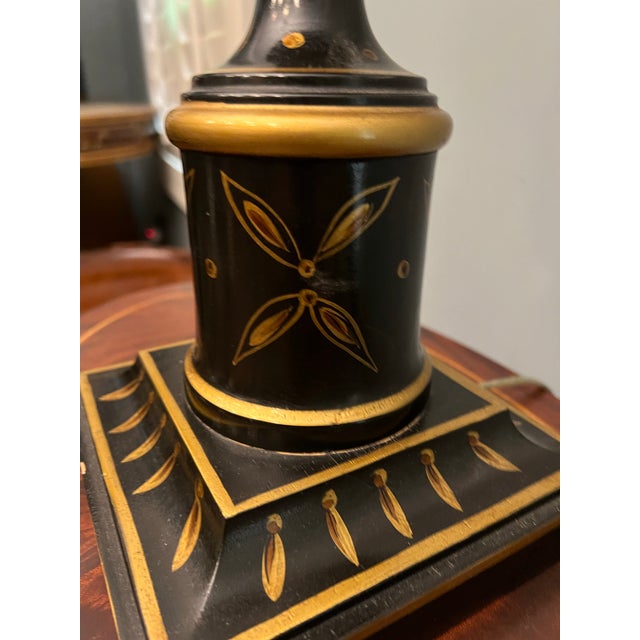 Elegant and quietly dramatic, this vintage black lacquer table lamp captures the timeless appeal of classic Chinoiserie...