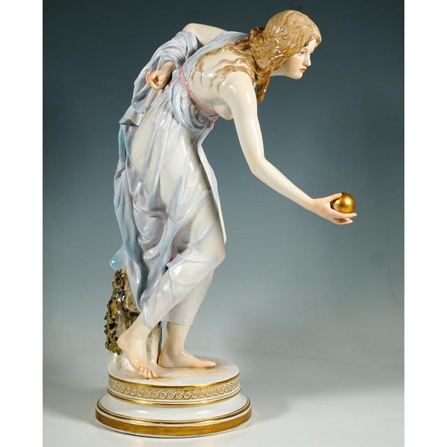 Extremely decorative, fully sculptural representation of an art nouveau beauty in a softly falling robe, tilted forward to...