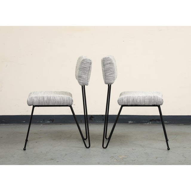 A pair of midcentury modern case study iron chairs with hairpin back legs. Airy and light silhouette makes them easy...