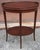 A mid century Mersman Federal Style Tiered Mahogany Oval Side Table With inllays and Gallery. Measures 23" in width, 16"...