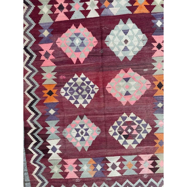 Nice vintage Turkish Anatolian Kilim with a beautiful geometrical and tribal design and nice colours with a purple and...