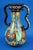 A beautiful two-handled vase in glazed and vitrified majolica ceramic, entirely hand-modeled on a lathe and decorated by...