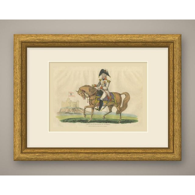 An original antique engraving, colored by hand, captioned "francis 2nd. Emperor of austria." the emperor rides a chestnut...