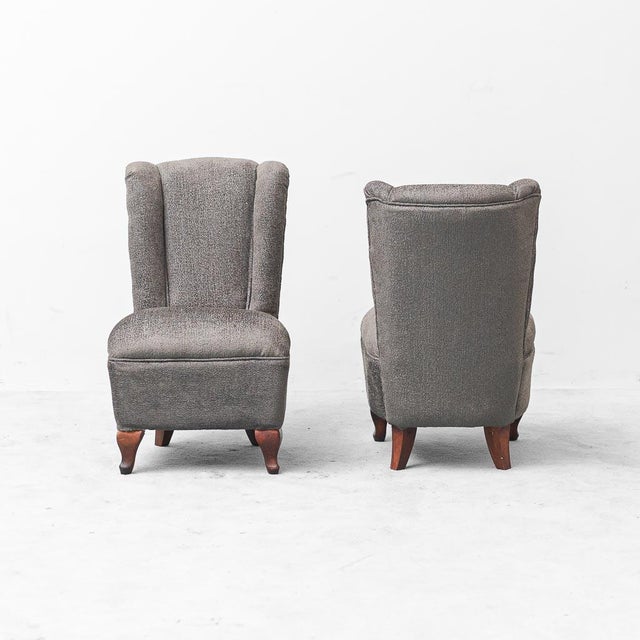 Pair of armchairs made in the 1950s. Fabric upholstery. Wooden frame and legs. Excellent condition.