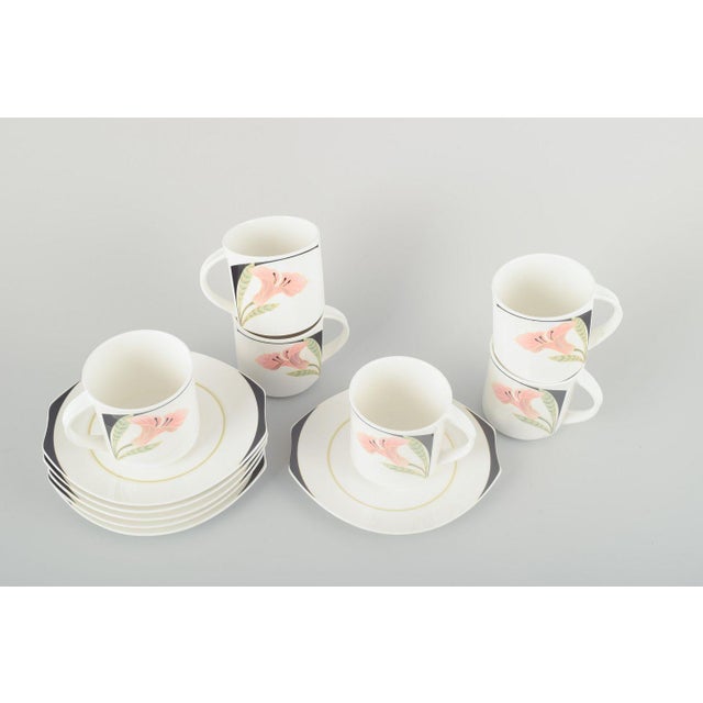 Villeroy & Boch 6 cups and saucers “Iris”, 1980s. Six porcelain cups with matching saucers, decorated with hand-painted...