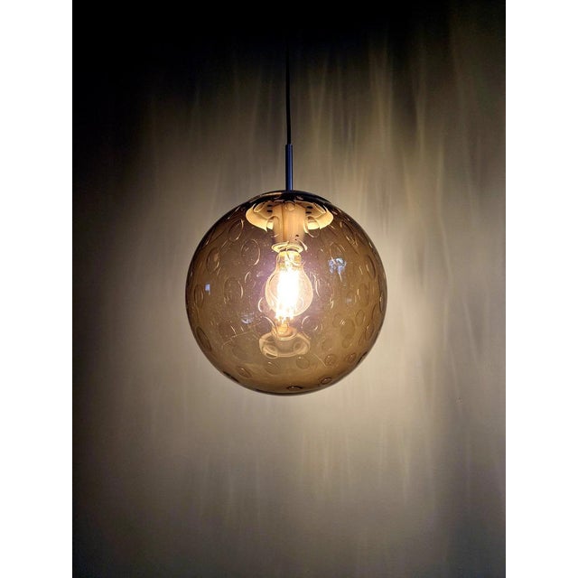 Space pendant light in smoked honeycomb glass with a chrome-plated metal frame, produced by the dutch manufacturer raak...