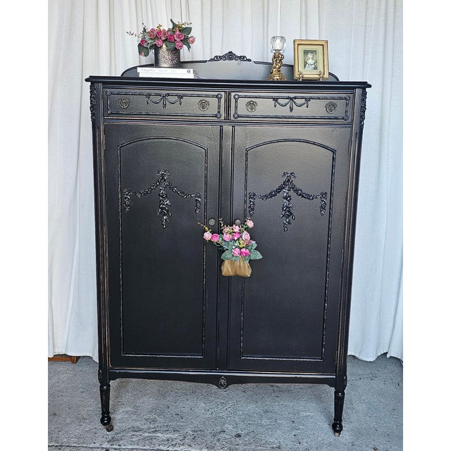 Gorgeous small Armoire, Black Ebonized Wardrobe, Baby Armoire, lingerie chest... You name it! This beautiful piece has...