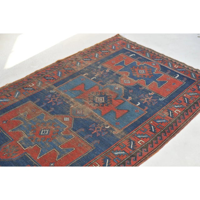 Name: Noah Size: 4.4 x 6.9 Age: Antique Pile: Low with some patina About: A GORGEOUS antique Kazak from a region where rug...