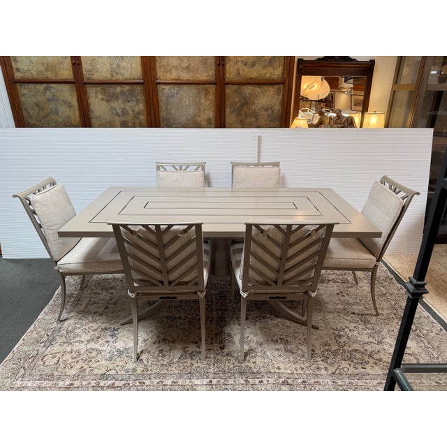 Design Plus Gallery presents an Outdoor Dining Table and Set of Six Side Chairs by McKinnon and Harris. The set includes...