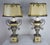 Pair of neoclassical style carved painted urns with silver gilt highlights and Greek Key design. The lamps are newly...