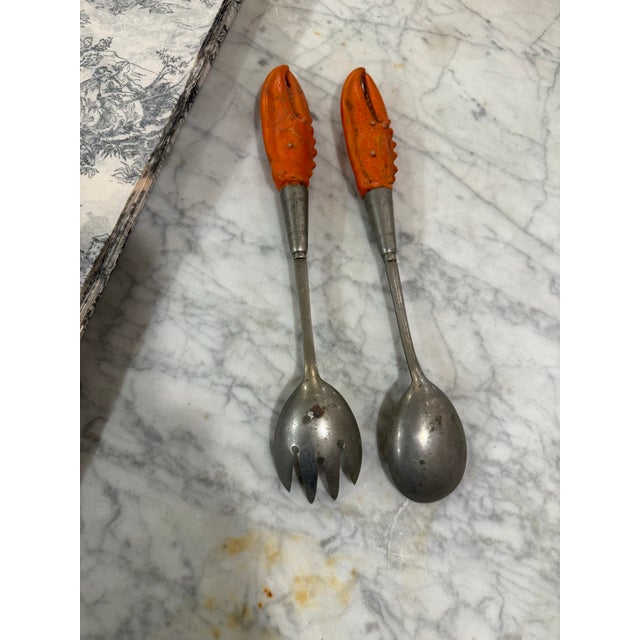 Pair of sweet antique German Musterschutz servers with lobster claw handles. Sure to be a conversation piece at your...