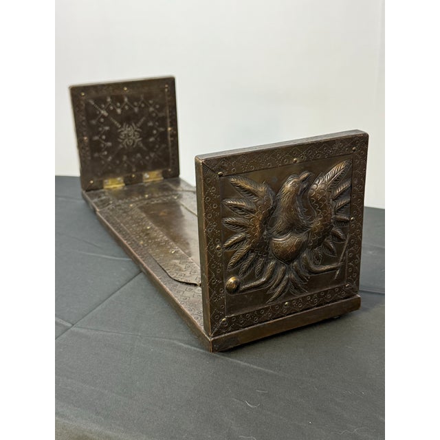 A rare decorative antique expandable library book rack dating to approximately the turn of the 20th century. Constructed...