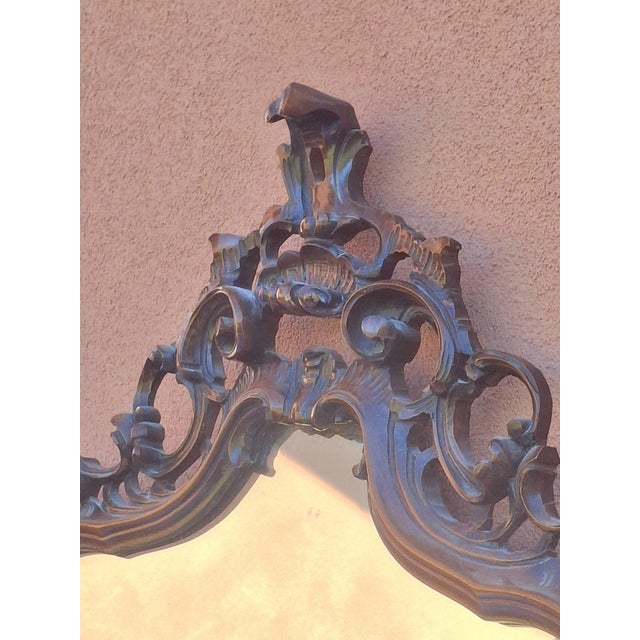 A superb large louis xv style wall mirror in carved and openwork wood, possessing rare elegance and a strong character....