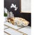 A large clam shell with gold interior works as a decorative bowl with beachy charm. Position on an entryway table or...