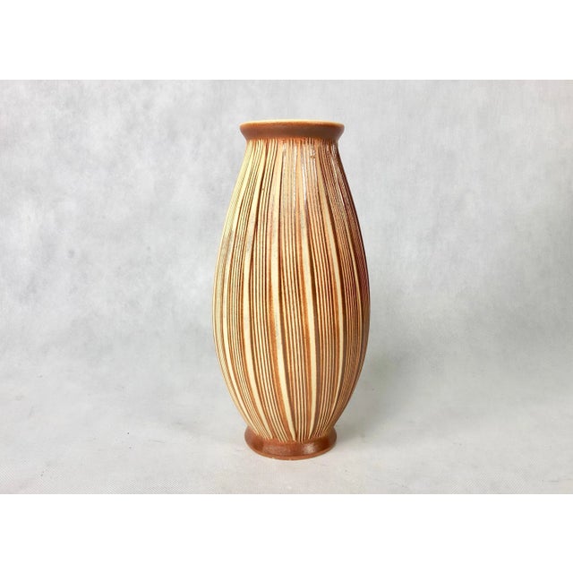 A vase made in the sgraffito technique from the "Kalamba" artistic ceramics factory in Neschwitz with a beautiful...