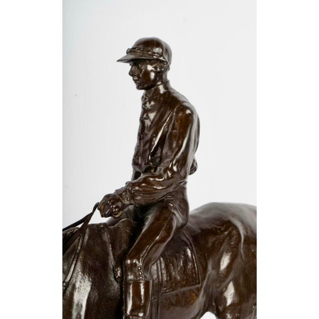 Pierre-Jules Mêne Style Equestrian Bronze Sculpture of Rider on Horse with Rouge Marble Base An elegant equestrian bronze...