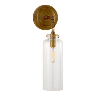 Thomas O'Brien for Visual Comfort Signature Katie Small Cylinder Sconce in Hand-Rubbed Antique Brass with Clear Glass For Sale