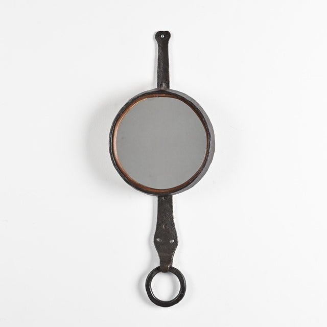 Wall mirror made by Léopold Gest in France around 1970. The hammered copper structure has a free-form shape reminiscent of...
