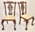 An English, Early 20th c. set of Twelve Hand Carved Chippendale Style Mahogany Dining Chairs, consisting of 2 Arm Chairs...
