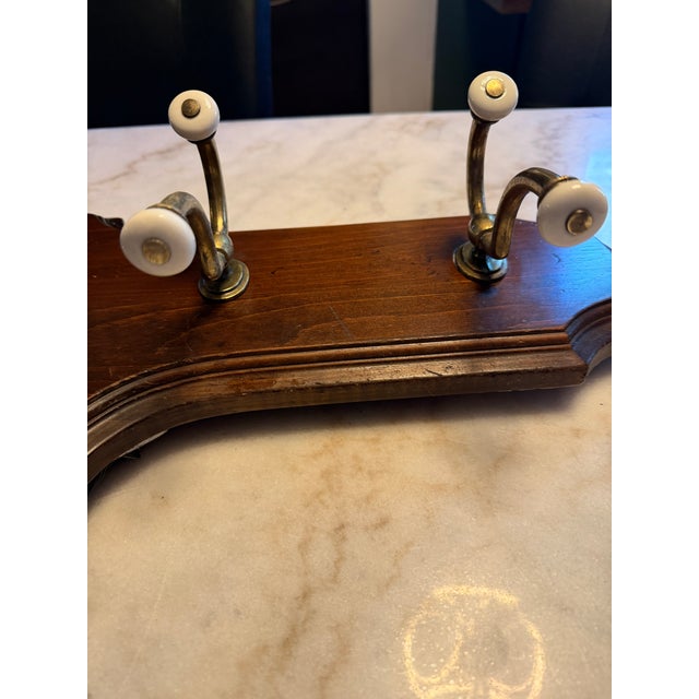Welcome guests to your home in timeless rustic style with this beautiful vintage Ethan Allen Hall Mirror and Coat Rack....