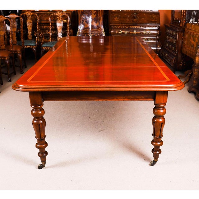 This is a beautiful antique William IV flame mahogany and decoratively crossbanded extending dining table, dating from...