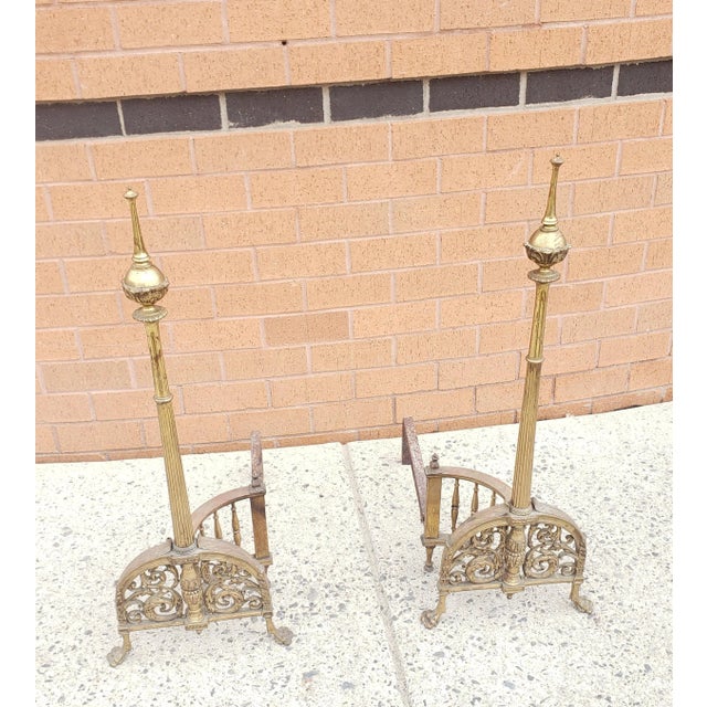 Early 20th Century Tall French Empire Brass and Iron Andirons, Pair. Measure 12" in width, 20" in depth and stand 32" tall.