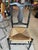 Pair of American Fiddleback or Queen Anne style side chairs with a black painted maple frame and a woven rush seat. It...