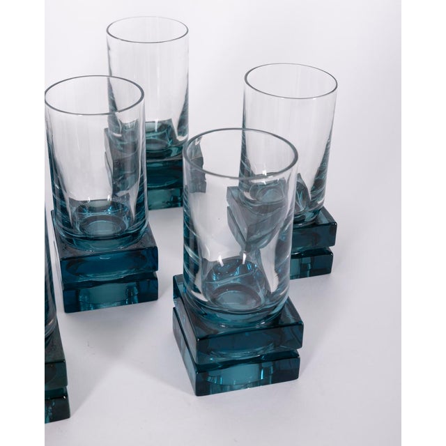 Set of 11 glasses with a square base in blue crystal and a transparent goblet, Italian design, 1970s.