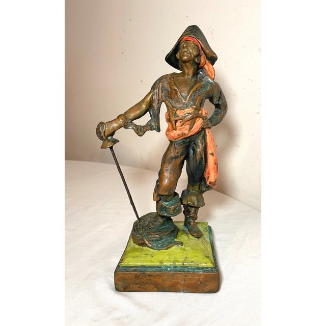 Up for sale is a wonderful antique bronze clad pirate statue made by Paul Herzel. It's done with elaborate detailing...