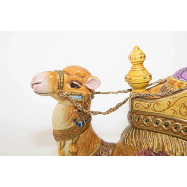 Hand Painted porcelain collectible Fitz and Floyd resting Nubian camel figurine. Beautifully detailed Arabian camel, the...