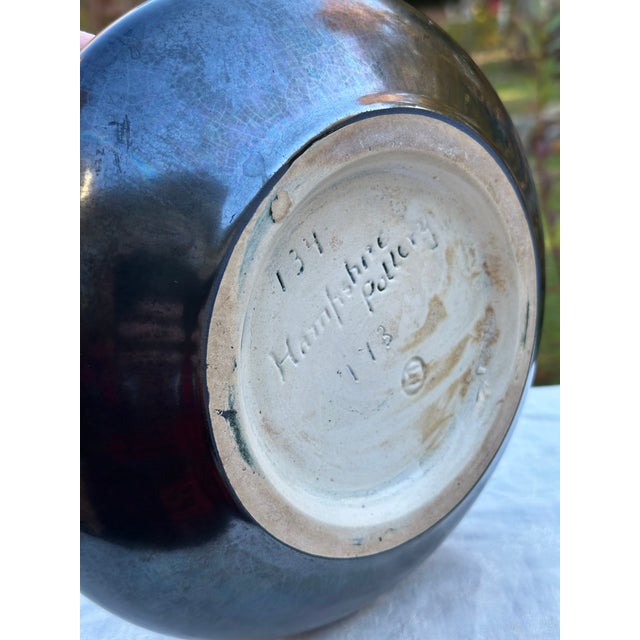An exceptional and highly collectible specimen of early 20th-century American art pottery, this low-profile bulb bowl was...