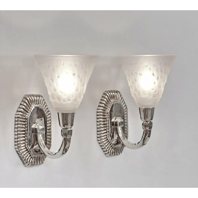 Capon frères & Muller A beautiful pair of French art deco wall sconces made around 1925-1930 in nickel plated solid brass...