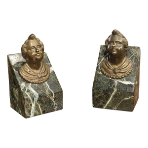 Pair of French Patinated Bronze Putti Heads Mounted to Sea Green Marble Plinths, C. 1700