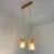 Subtle vintage ceiling lamp consisting of a wooden ceiling plate with two amber pendant lights mounted on it. These ribbed...