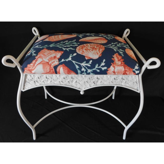 Beautiful vintage mid century ornate white iron vanity bench with blue coral upholstery. Made in the USA - Circa 1960s.