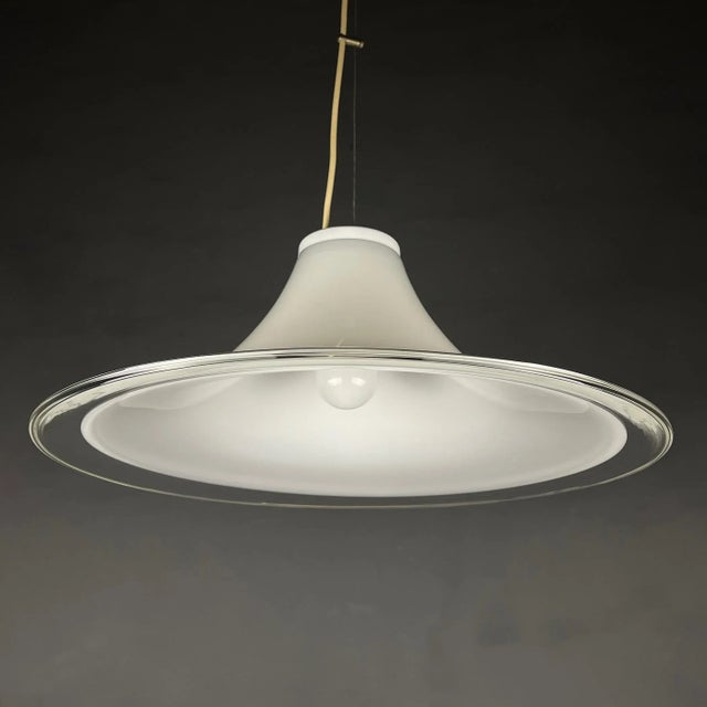 The stylish and elegant, this milky white murano glass pendant lamp is a classic example of 70s italian lighting. Made in...