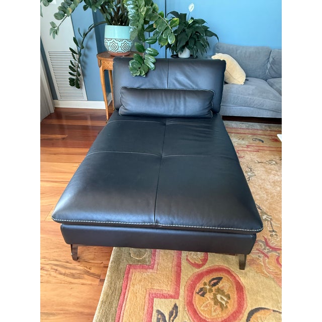 Designer chaise lounge by Roche Bobois. Crafted with premium black leather and sleek modern lines, this piece combines...