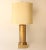 This vintage table lamp features a gold-backed crackle glass cylinder with brushed brass accents. It measures 33" to the...