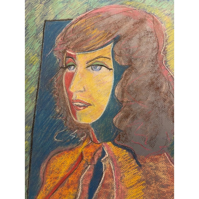 A compelling pair of original pastel portraits by artist M. Bierman, dated 1990. These expressive female studies are...