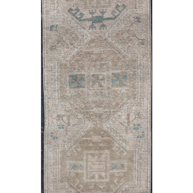 Measures: 3'3 x 20'0 Long Vintage Turkish Oushak Runner with Soft Taupe, Sand, and Pale Teal. Keivan Woven Arts /...