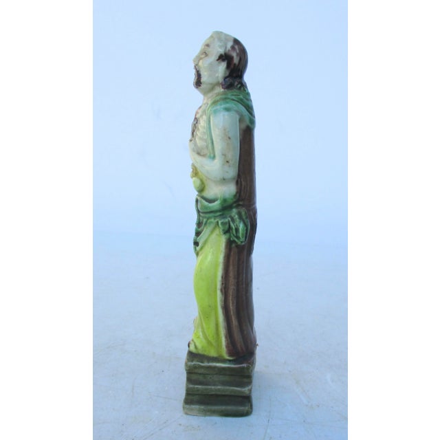 Porcelain polychrome Chinese immortal figure. Standing on a draped pedestal. Very good coloring and good casting. The size...