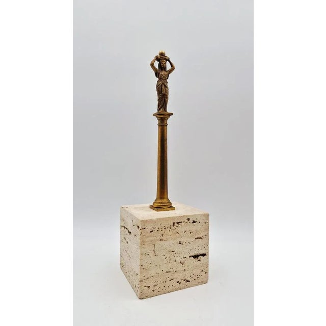 Gilded bronze sculpture depicting Ancient Egypt from the late 19th century, with a travertine marble base. Base...
