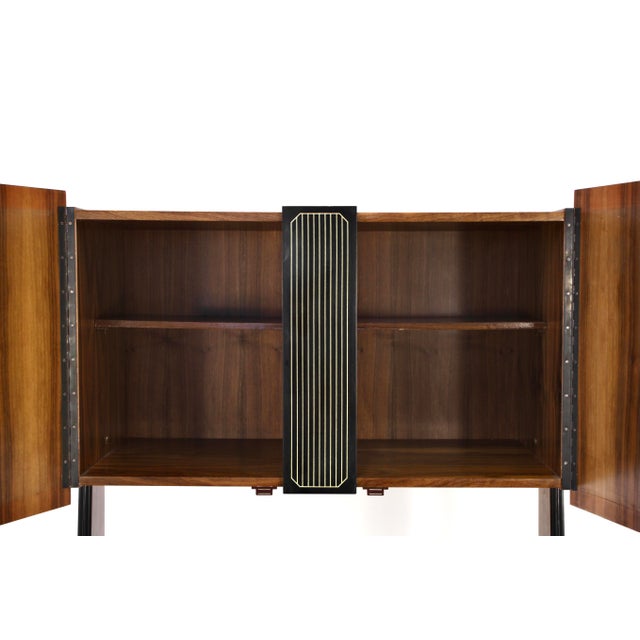 Mid-Century Modern Italian Freestanding Teak and Brass Modular Bookshelf, 1960s, in Very Good conditions. Designed 1960 to...