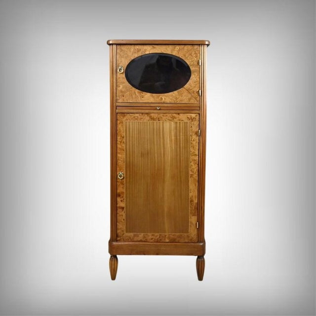 This Art Deco cabinet embodies the sophistication of the 1930s, combining decorative refinement with generous...