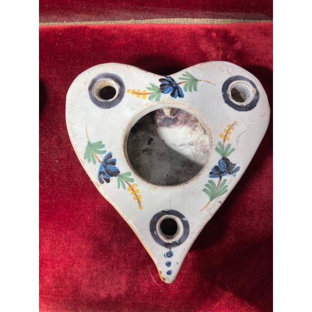 A charming antique French faience inkwell, beautifully formed in a rare and decorative heart shape. This delightful piece...